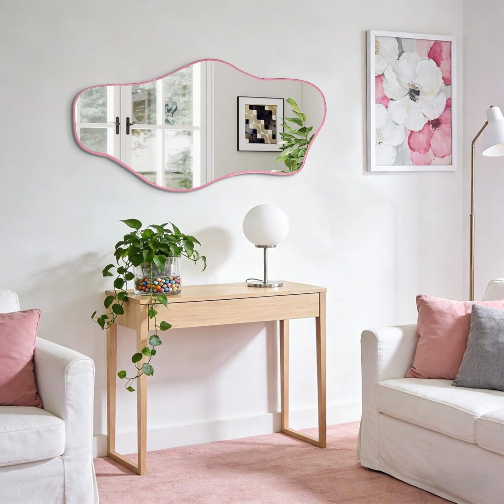asymmetrical wall mirror with pink frame