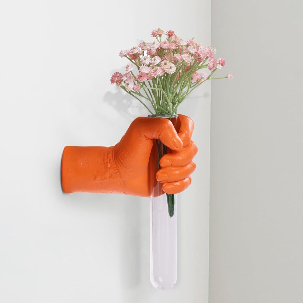 orange hand vase wall sculpture