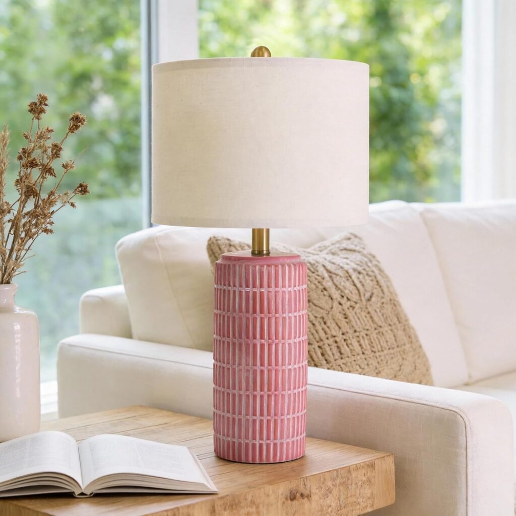 pink ceramic lamp on side table