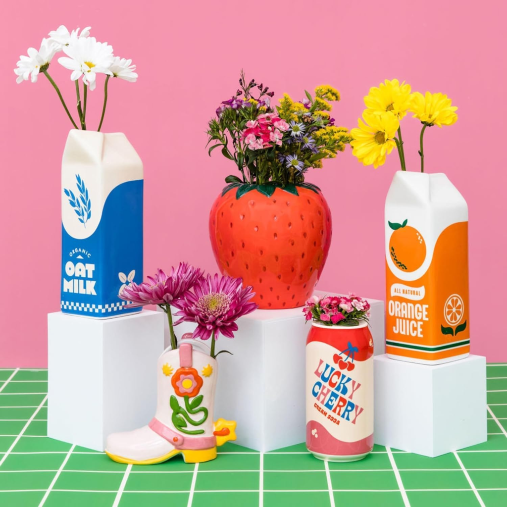 decorative ceramic vases inspired by fruit and milk and orange juice acartons